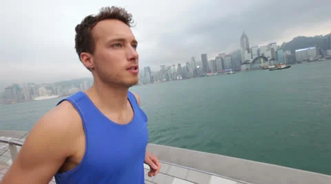 Running man runner jogging in Hong Kong city Stock Footage 25961872