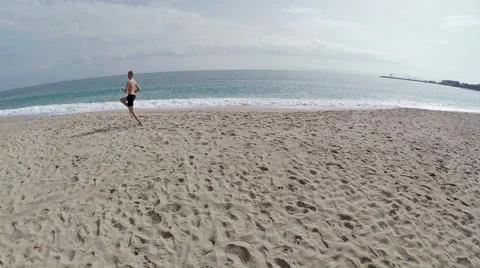 Running man on seaside with background of the sea. Aerial view. France, Corsica. Video stock 47383910