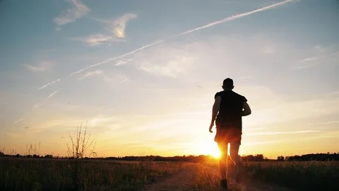 Running man on sky background during sunset, Stock Footage 77086215