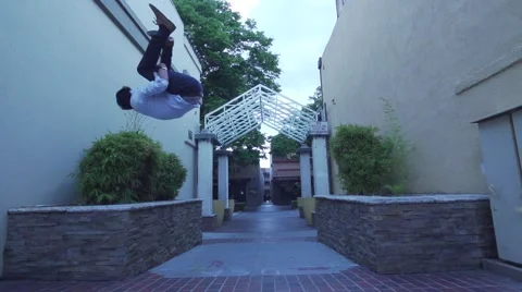 Running Man In Suit Does Side Flip then Runs Down Alley. Stock-Footage 50481692