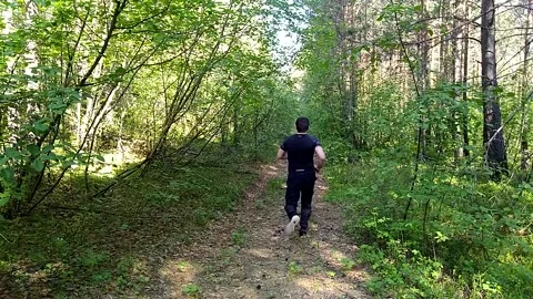 Running man through the forest-3 Stock Footage 156187122