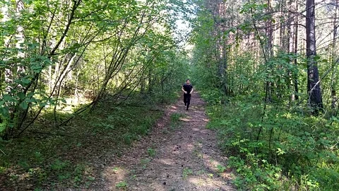 Running man through the forest-4 Stock Footage 156187124
