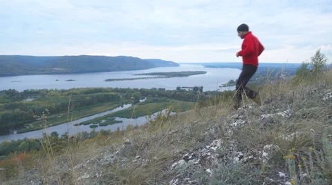 Running man trail runner in cross-country training run. Male athlete sports r Stock Footage