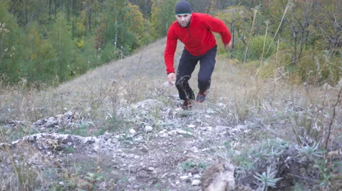 Running man trail runner in cross-country training run. Male athlete sports r Stock Footage