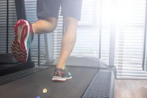 Running man on treadmill Stock Photos
