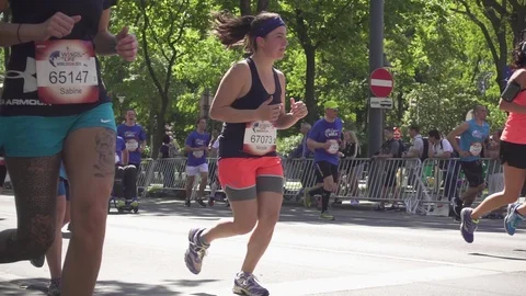 Running marathon runners closeup Slow Motion Stock Footage 89830060