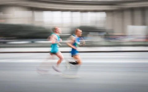 Running men in fast motion Stock Photos