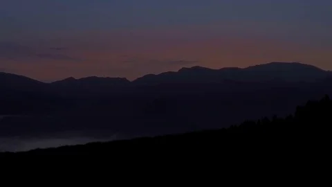 Running on the mountain at sunset Stock Footage 77915493