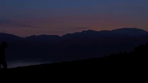 Running on the mountain at sunset Stock Footage 77915496