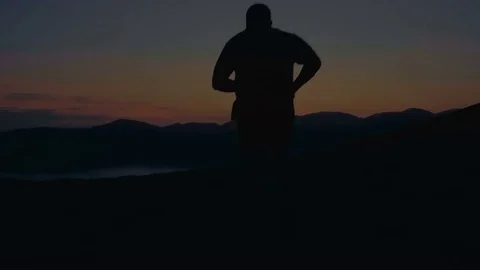 Running on the mountain at sunset Video stock 77915534