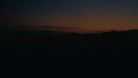 Running on the mountain at sunset Stock Footage 77915584
