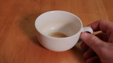 Running out of coffee, empty cup Stock Footage