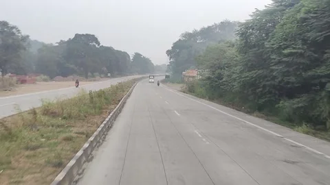Running outside the car window, with trees and a cloudy sky Stock Footage 293243476
