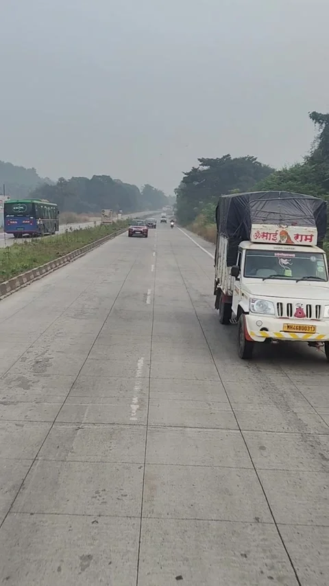 Running outside the car window, with trees and a cloudy sky Stock Footage 293243972