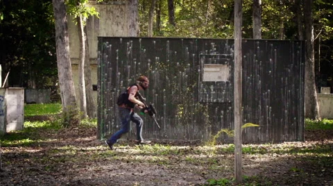 Running from paint grenade Stock Footage 63553186