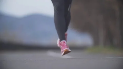 Running in the park. Close-up. Slow motion. Stock Footage 70952908