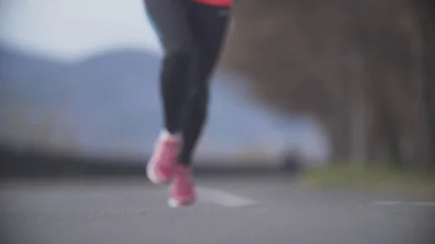 Running in the park. Close-up. Slow motion. Video stock 70953095