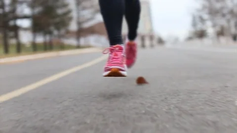 Running in the park. Close-up. Slow motion. 스톡 동영상 70953098