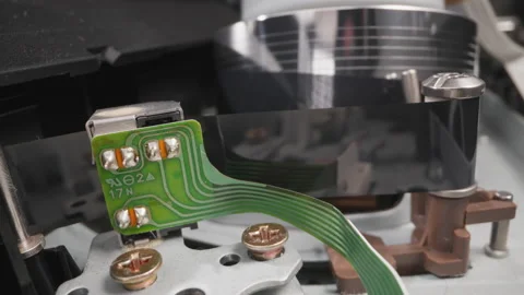 Running part pulls tape to head of videocassette recorder Stock Footage 173413212