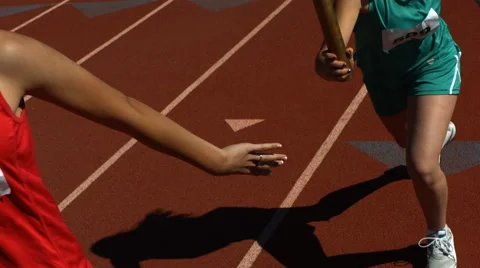 Running passing baton in relay Stock Footage