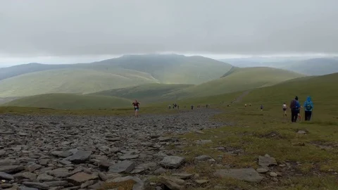Running race and hiking in the mountains Stock Footage