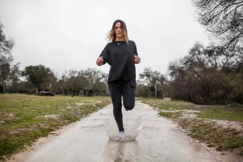 Running in the rain Stock Photos