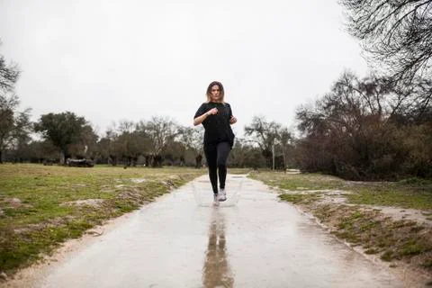 Running in the rain Stock Photos