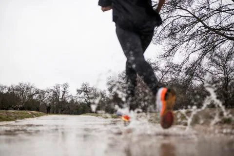 Running in the rain Stock Photos