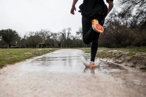 Running in the rain Stock Photos
