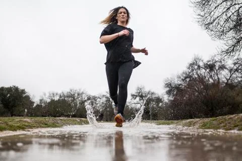 Running in the rain Stock Photos