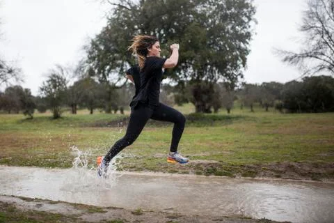 Running in the rain Stock Photos