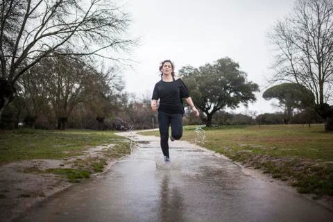 Running in the rain Stock Photos