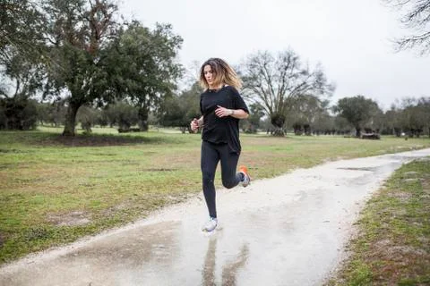 Running in the rain Stock Photos