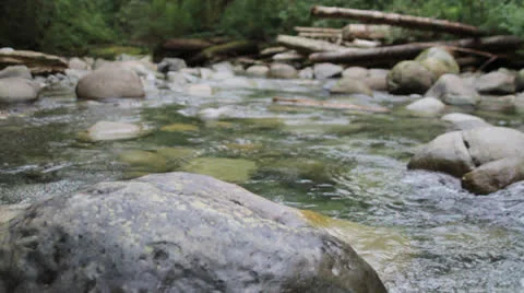 Running river water 2 Stock Footage 23425815