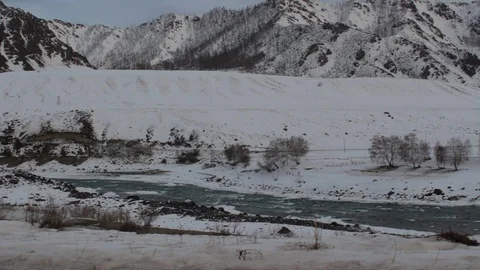 Running river in winter snow mountains 스톡 동영상 73756321