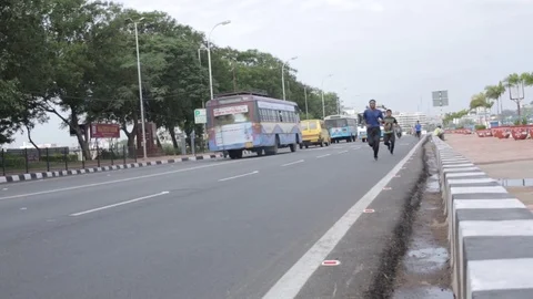Running on the road Stock Footage 75031827
