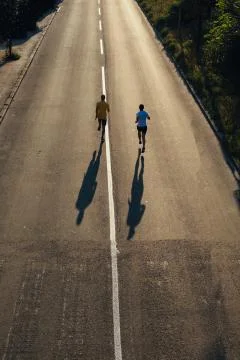 Running on the road Stock Photos