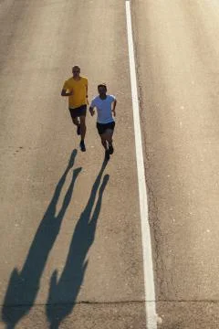 Running on the road Stock Photos