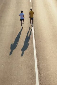 Running on the road Stock Photos