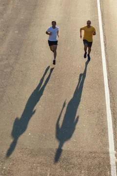 Running on the road Stock Photos