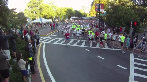 Running Road Race Start around Bend Stock Footage 51137533