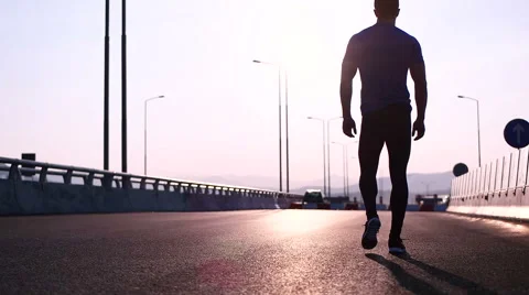 Running runner man athlete training outdoors exercising on mountain road at s Stock Footage 67333428