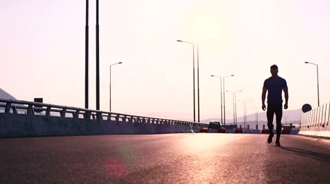 Running runner man athlete training outdoors exercising on mountain road at s Stock Footage 67354636