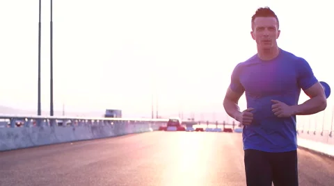 Running runner man athlete training outdoors exercising on mountain road at s Stock Footage 67357075