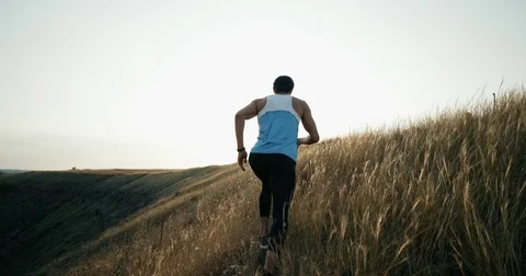 Running runner man jogging at sunset. Male jogger training for marathon run Stock Footage 81129395