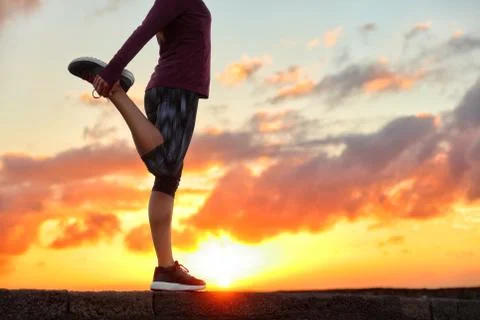 Running runner stretching leg preparing for run Stock Photos