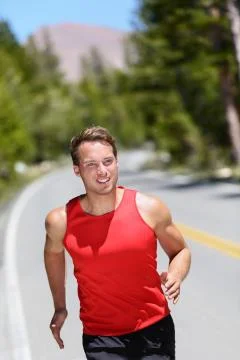 Running runner training cardio on forest road Stock Photos