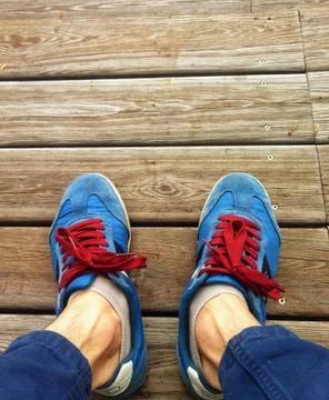 In running shoes on the deck Stock Photos