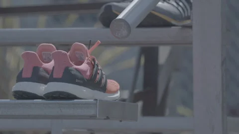 Running Shoes Left on Bench Stock Footage 154001329