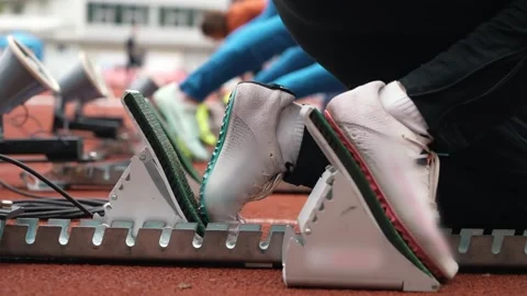 Running on a short distance, preparation for the start on the starting blocks Stock Footage 274598056